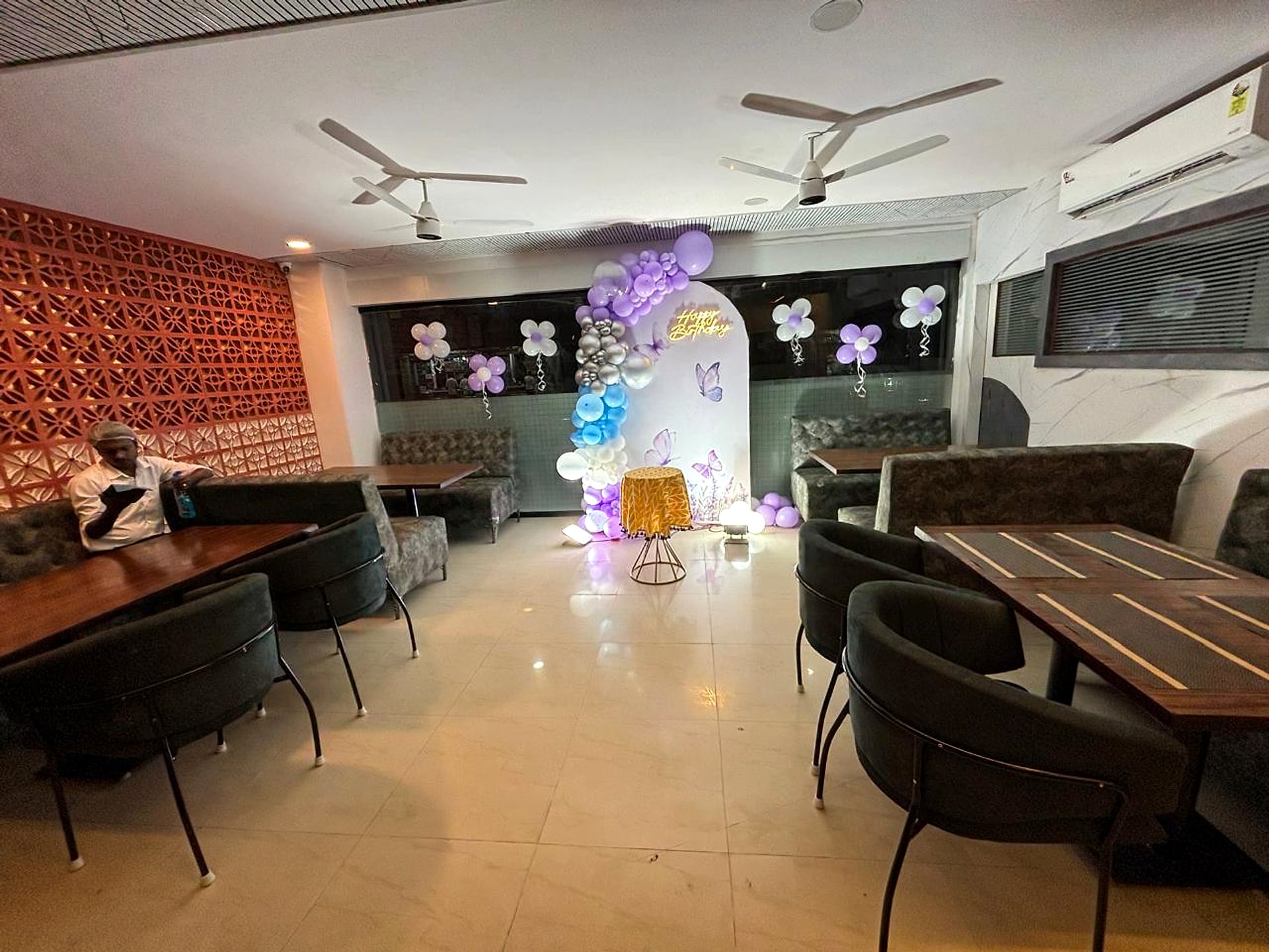 banquet hall set up for a birthday celebration, balloon decor