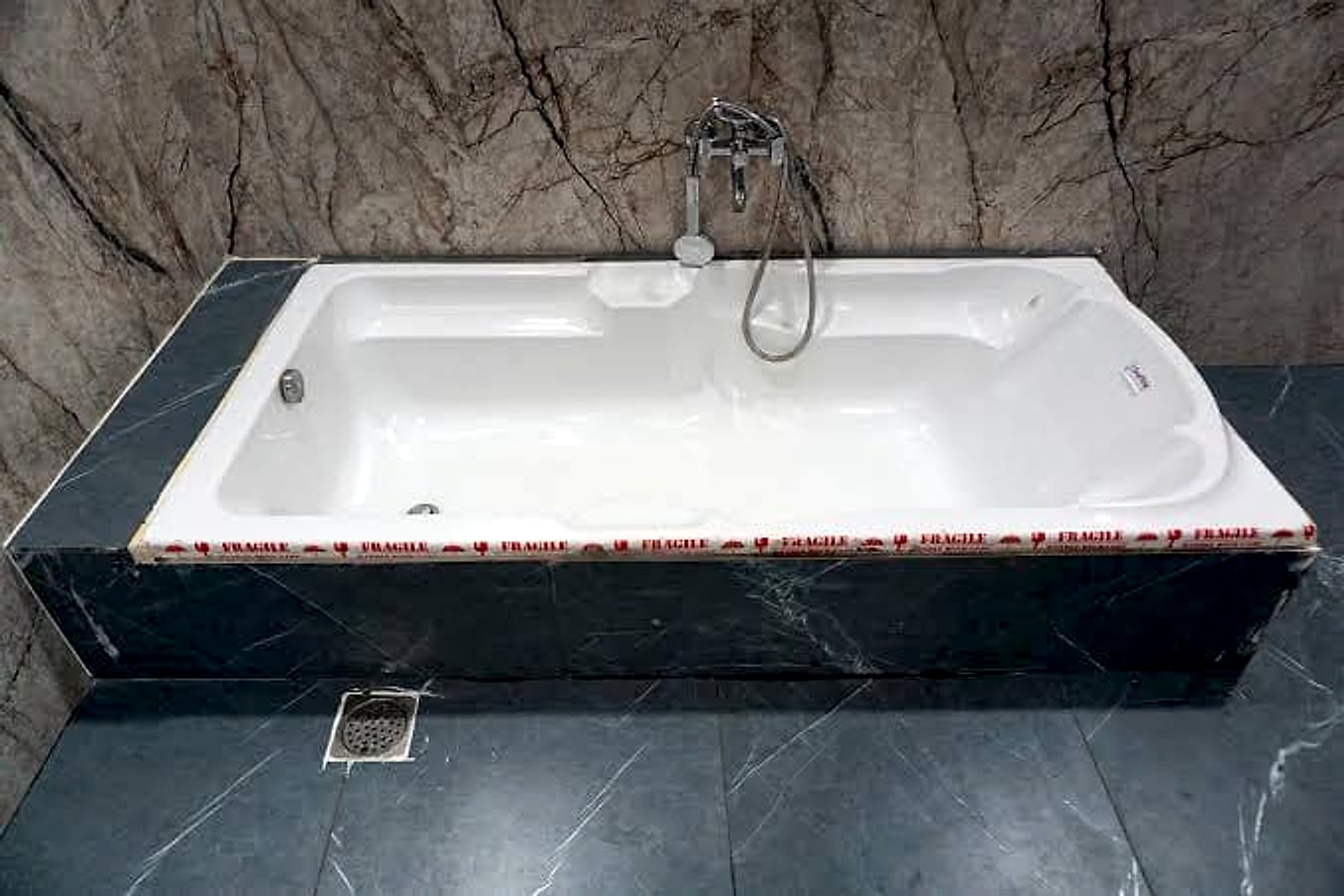 marble bathtub, still has protective fragile tape (staging photo)