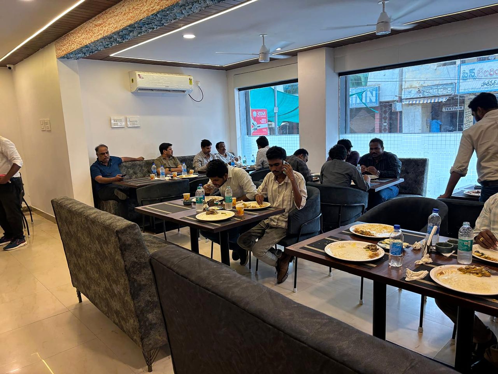 restaurant seating, guests dining, street-view windows