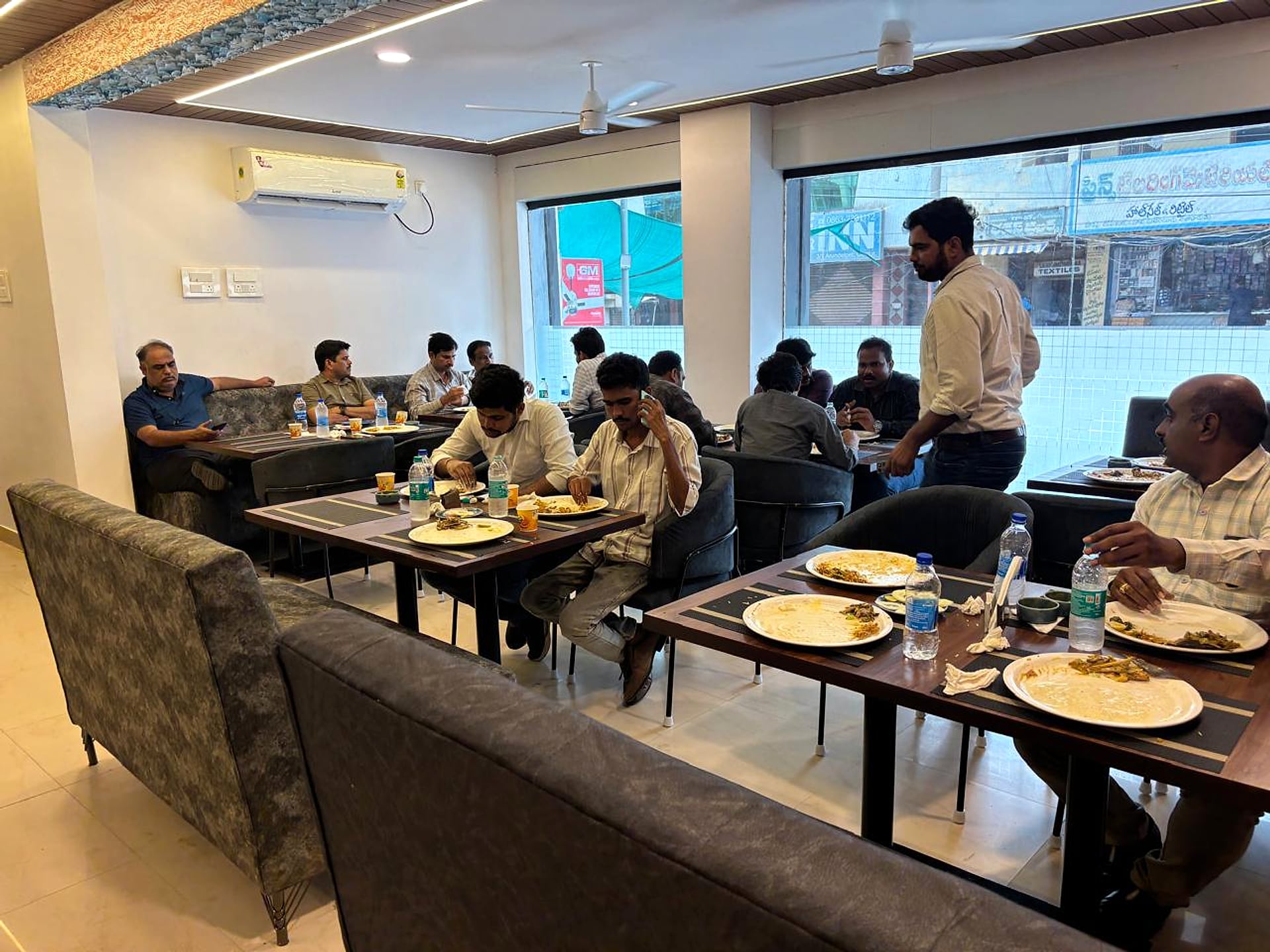 Guests enjoying a meal at Leela Veg Bhavan