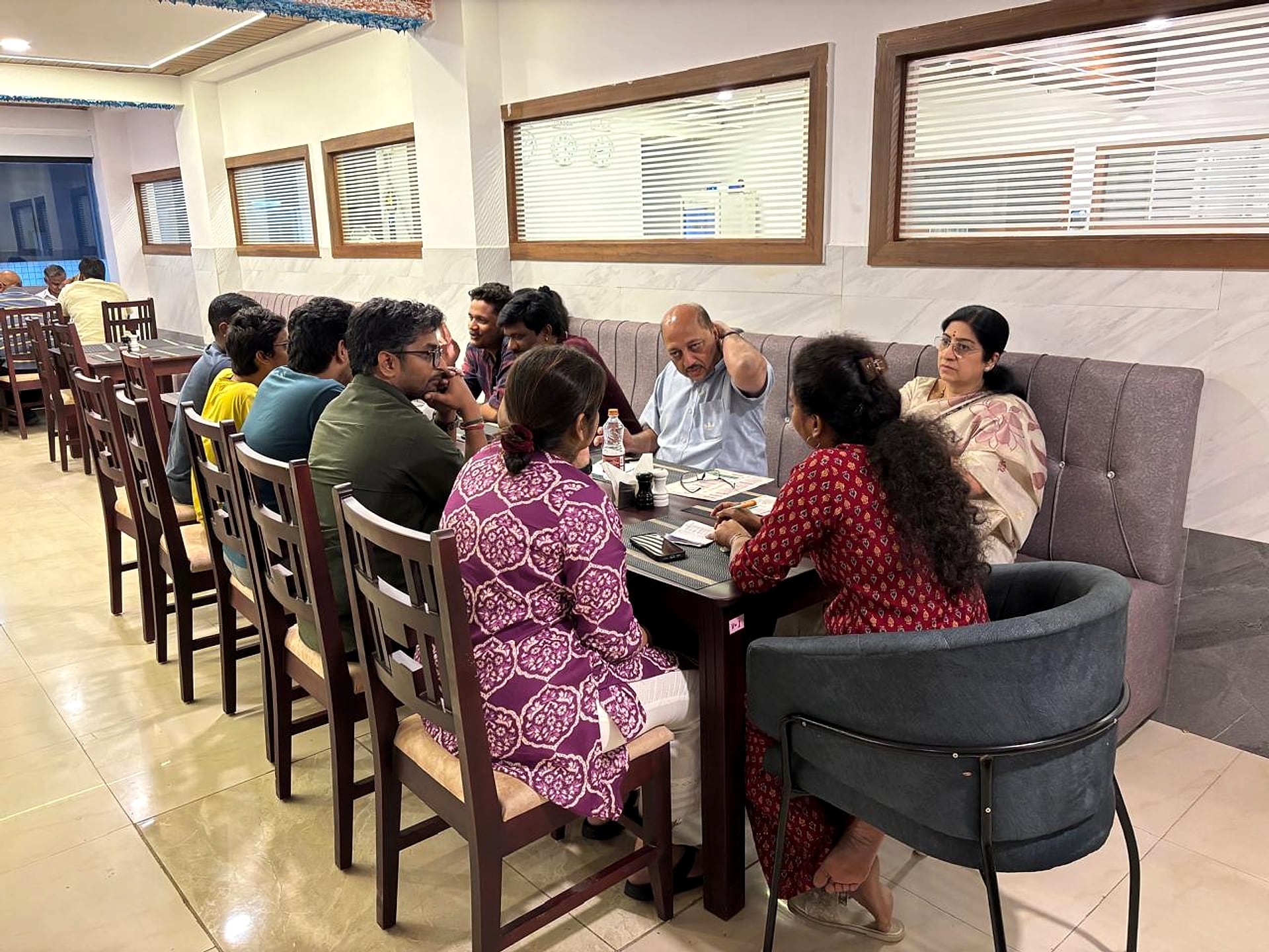 restaurant, large group seated for a family meal
