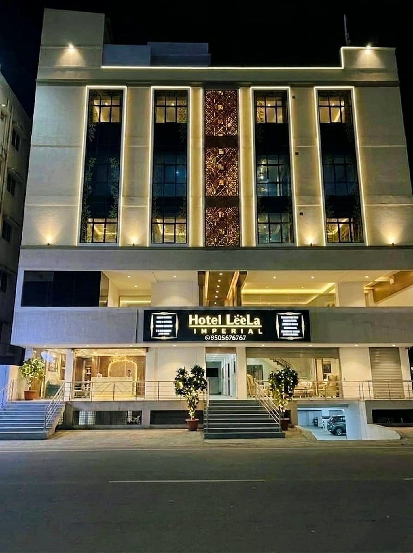 facade at night, 'Hotel LeeLa IMPERIAL' signage clearly lit, entrance steps - best exterior/hero shot