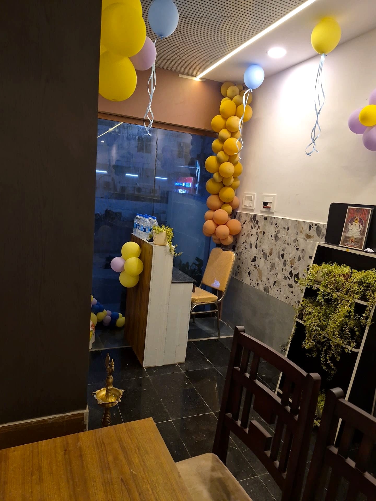 reception area decorated with event balloons - cluttered